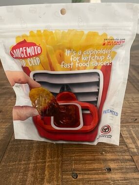 Saucemoto Dip Clip designed to hold fast-food sauce containers securely